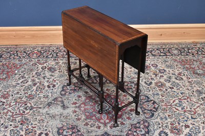 Lot 104 - An Edwardian inlaid mahogany Sutherland table,...