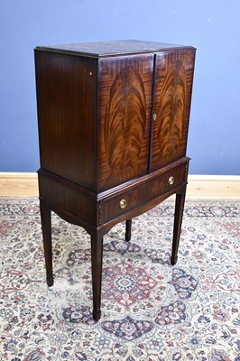 Lot 242 - A reproduction mahogany cocktail cabinet, with...