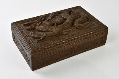 Lot 1323 - A Chinese hardwood carved box with stylised...