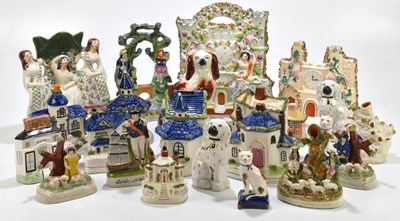 Lot 590 - A quantity of Staffordshire flatback figures...