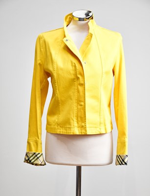 Lot 886 - BURBERRY; a yellow cotton lady's short jacket,...