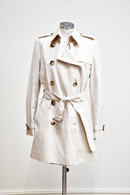 Lot 877 - BURBERRY; a lady's short light beige trench...