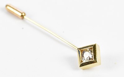 Lot 431 - A yellow metal stick pin with collet set round...