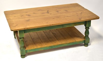 Lot 41 - A contemporary stained pine coffee table, with...