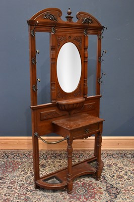 Lot 1038 - A Victorian carved walnut hall stand, with...