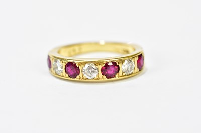 Lot 96 - An 18ct yellow gold five stone ruby and...