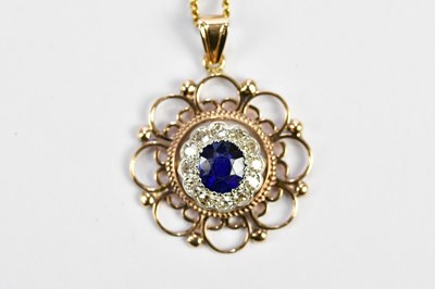 Lot 351 - A 9ct yellow gold pendant centred with a ring...