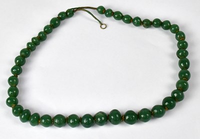 Lot 808 - A green hardstone beaded necklace, with...