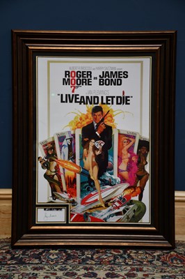Lot 352 - ROGER MOORE; a framed reproduction poster,...