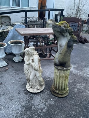Lot 1237 - Two reconstituted stone figures, including an...