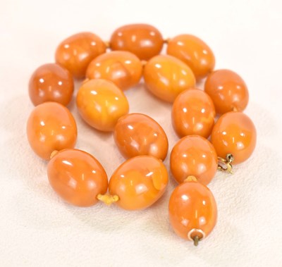Lot 1265 - A vintage hand tied egg yolk/butterscotch...