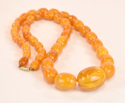 Lot 1268 - A vintage graduated egg yolk/butterscotch...