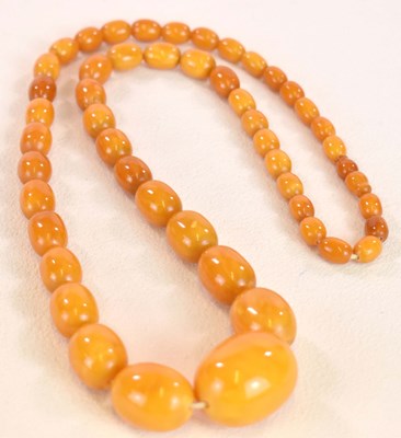 Lot 1273 - A vintage egg yolk/butterscotch graduated...