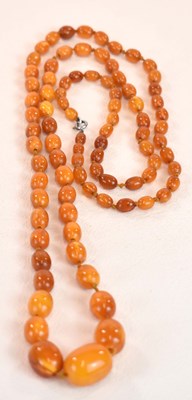 Lot 1275 - A vintage hand tied egg yolk/butterscotch...