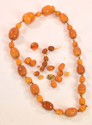 Lot 1276 - A vintage hand tied egg yolk/butterscotch...