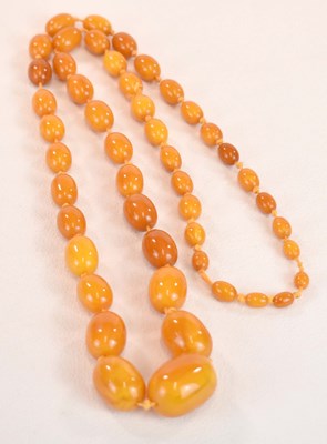 Lot 1279 - A vintage hand tied egg yolk/butterscotch...