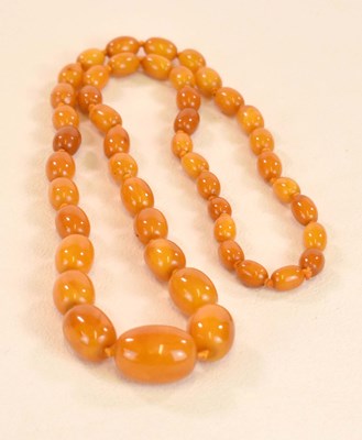 Lot 1280 - A vintage hand tied egg yolk/butterscotch...