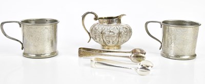 Lot 2512 - An Indian white metal jug of squat bulbous...