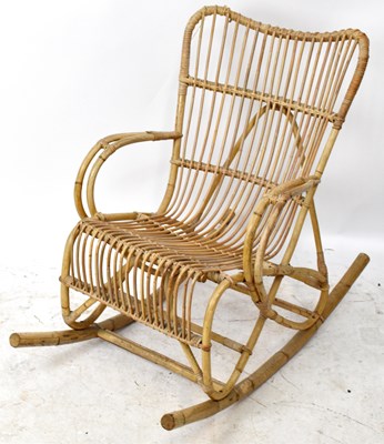 Lot 1714 - A vintage wicker rocking chair.