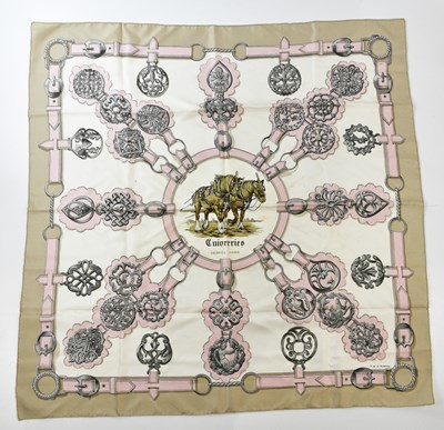 Lot 816 - HERMÈS; a 100% silk Cuivreries scarf, in beige,...