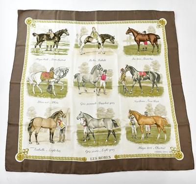 Lot 808 - HERMÈS; a 100% silk Les Robes scarf depicting...