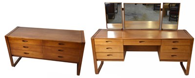 Lot 1704 - UNIFLEX; a teak mirror back dressing table,...
