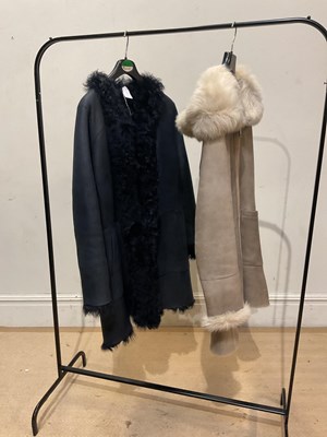 Lot 1973 - CELTIC & CO; a black short sheepskin coat,...