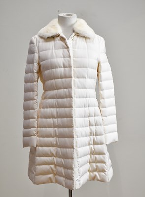 Lot 879 - MONCLER; an unused cream padded coat with...