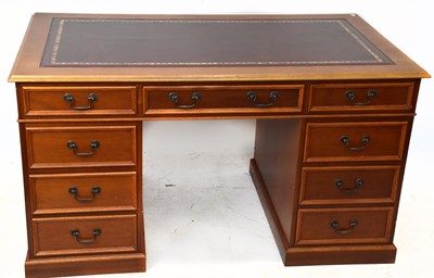 Lot 1748 - A reproduction knee-hole twin pedestal desk...