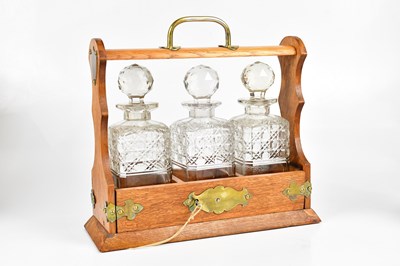 Lot 1259 - An early 19th century oak cased three bottle...