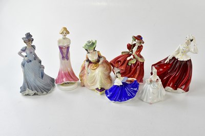 Lot 2712 - ROYAL DOULTON; a collection of five figures...