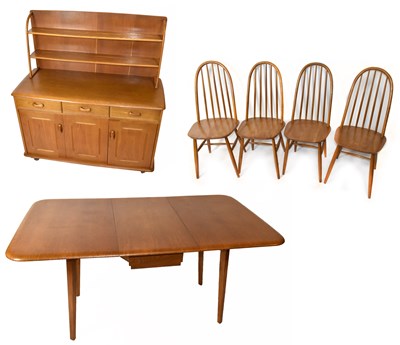 Lot 3008 - A 1970s light oak dining suite comprising drop-...