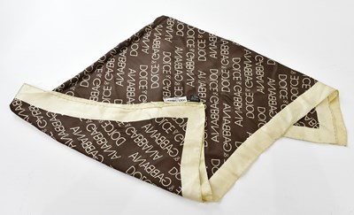 Lot 868 - DOLCE & GABANNA; a 100% silk cream and brown...