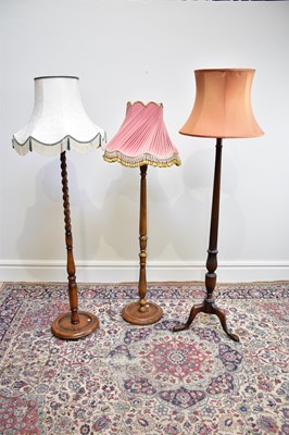 Lot 1559 - Three 20th century standard lamps, including a...