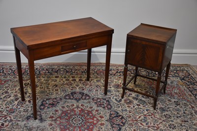 Lot 1089 - A 19th century mahogany foldover tea table on...