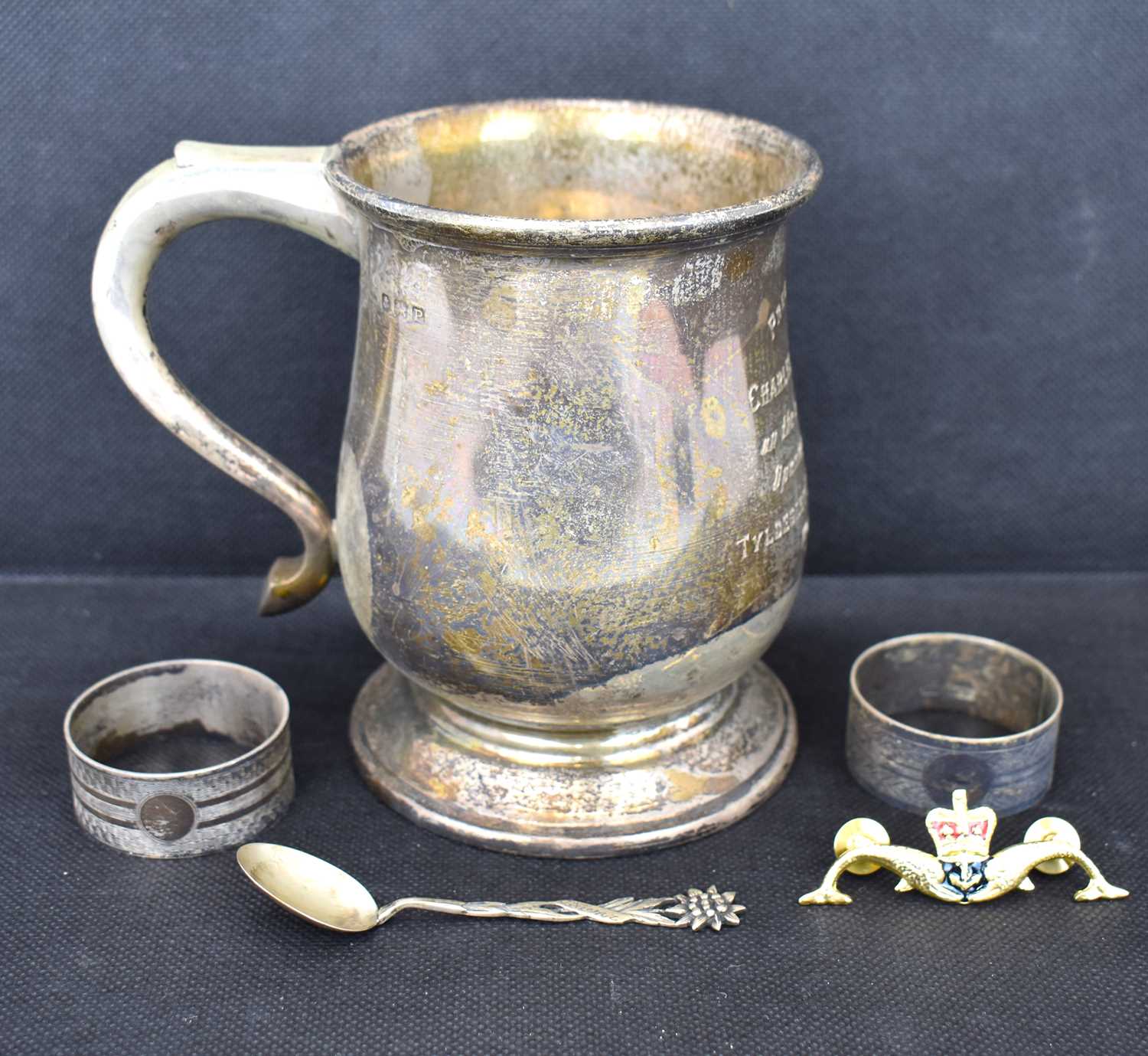 Lot 568 - A hallmarked silver mug inscribed 'Presented...