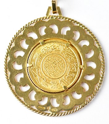 Lot 765 - A Saudi Arabian guinea in an 18ct yellow gold...
