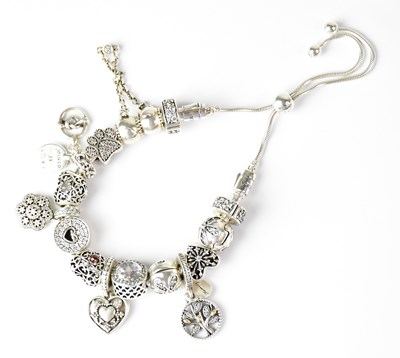 Lot 752 - PANDORA; a sterling silver adjustable bracelet...
