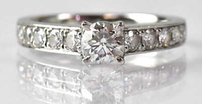 Lot 688 - A platinum diamond solitaire ring, with five...