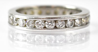 Lot 689 - A platinum and diamond eternity ring set with...