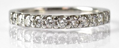 Lot 690 - A platinum and diamond half eternity ring,...