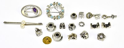 Lot 1570 - A silver and amethyst cabochon set pierced...