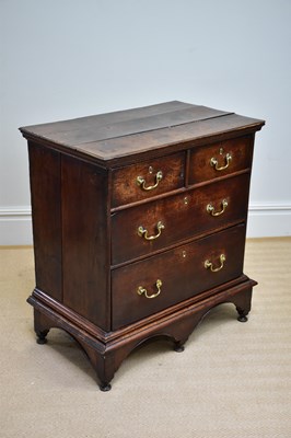 Lot 1183 - A Georgian oak chest of two short over two...