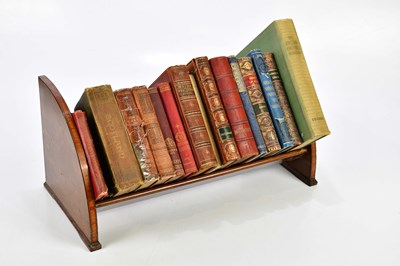 Lot 1308 - An Edwardian inlaid mahogany book trough...