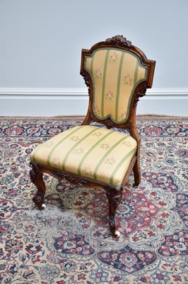 Lot 1064 - A Victorian walnut dressing chair with shaped...