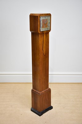 Lot 1545 - A walnut cased Art Deco grandmother clock with...