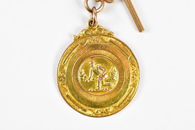 Lot 5 - A 9ct yellow gold bowling medal, given by Dr G...
