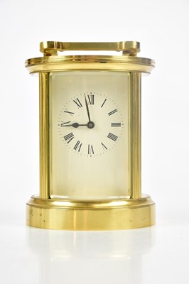 Lot 405 - A modern brass circular carriage timepiece,...