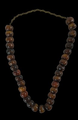Lot 682 - A strand of cherry amber beads, length approx...