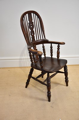 Lot 1184 - A 19th century elm seated hoop back Windsor...